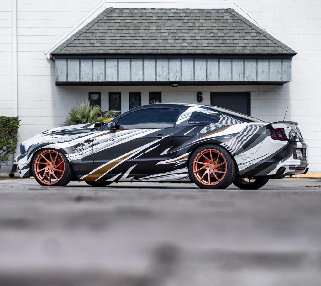 A Ford Mustang wrapped in graphics.