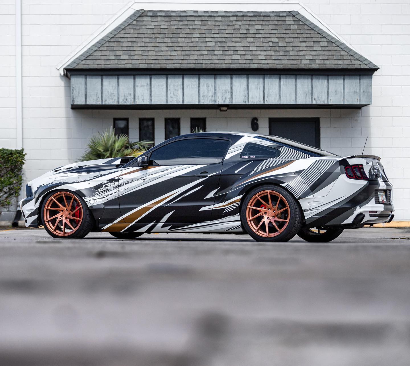 A Ford Mustang wrapped in graphics.